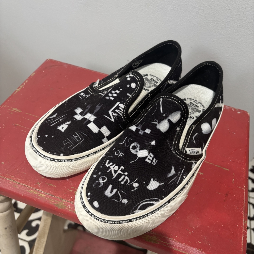 Vans Black and White Graphic Slip-On Sneakers